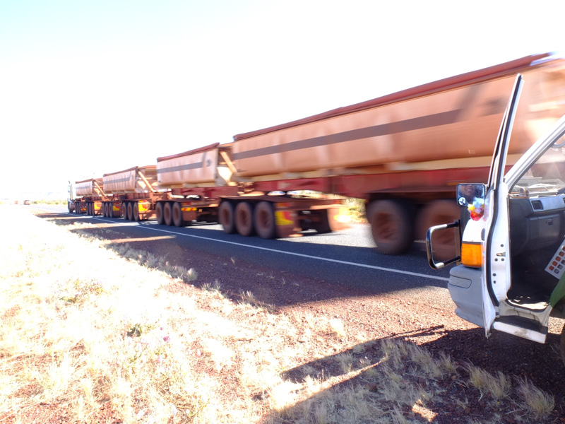 Road train rushing past